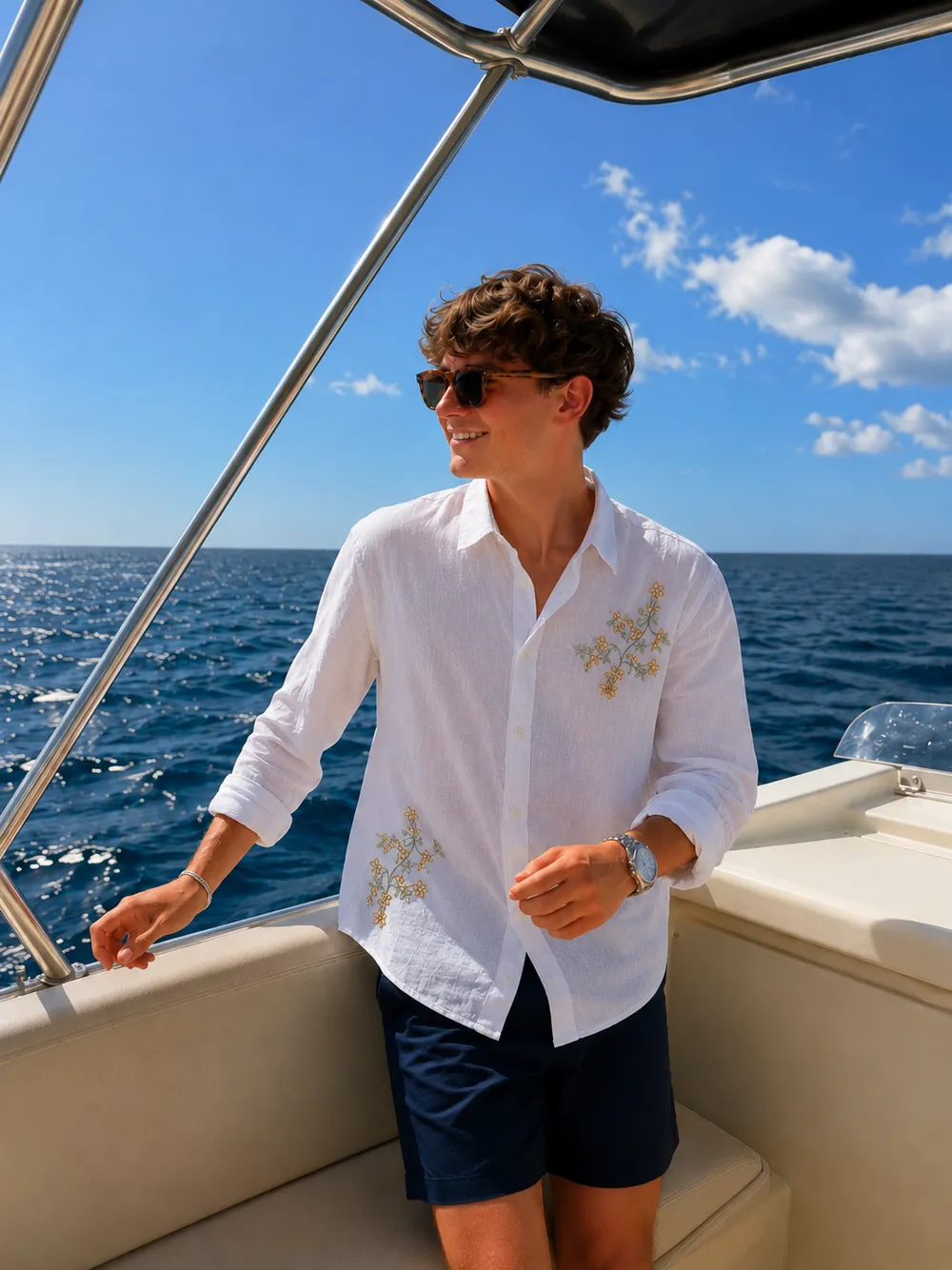 White embroidered linen shirt on a boat at sea