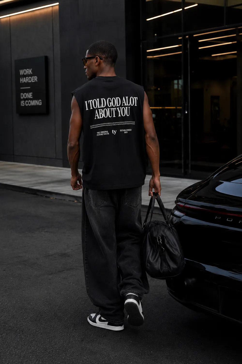 Black sleeveless back print on a night street